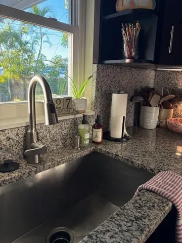 a bedroom with bed and wooden floor