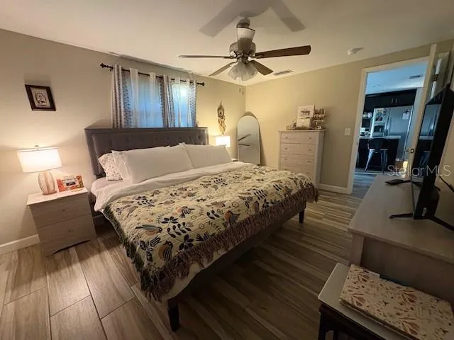 a bedroom with a bed and a dresser