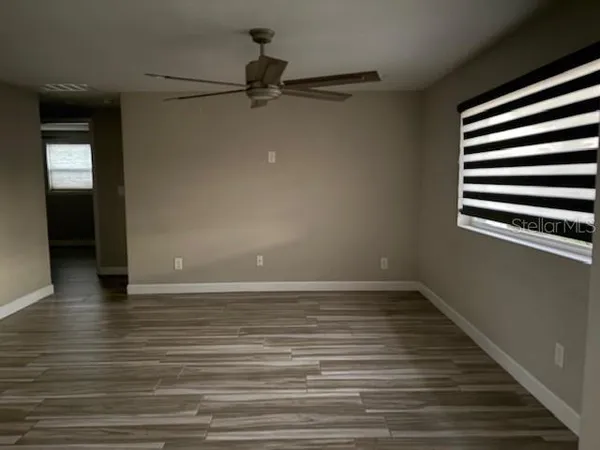 a living room with a couch and a large window