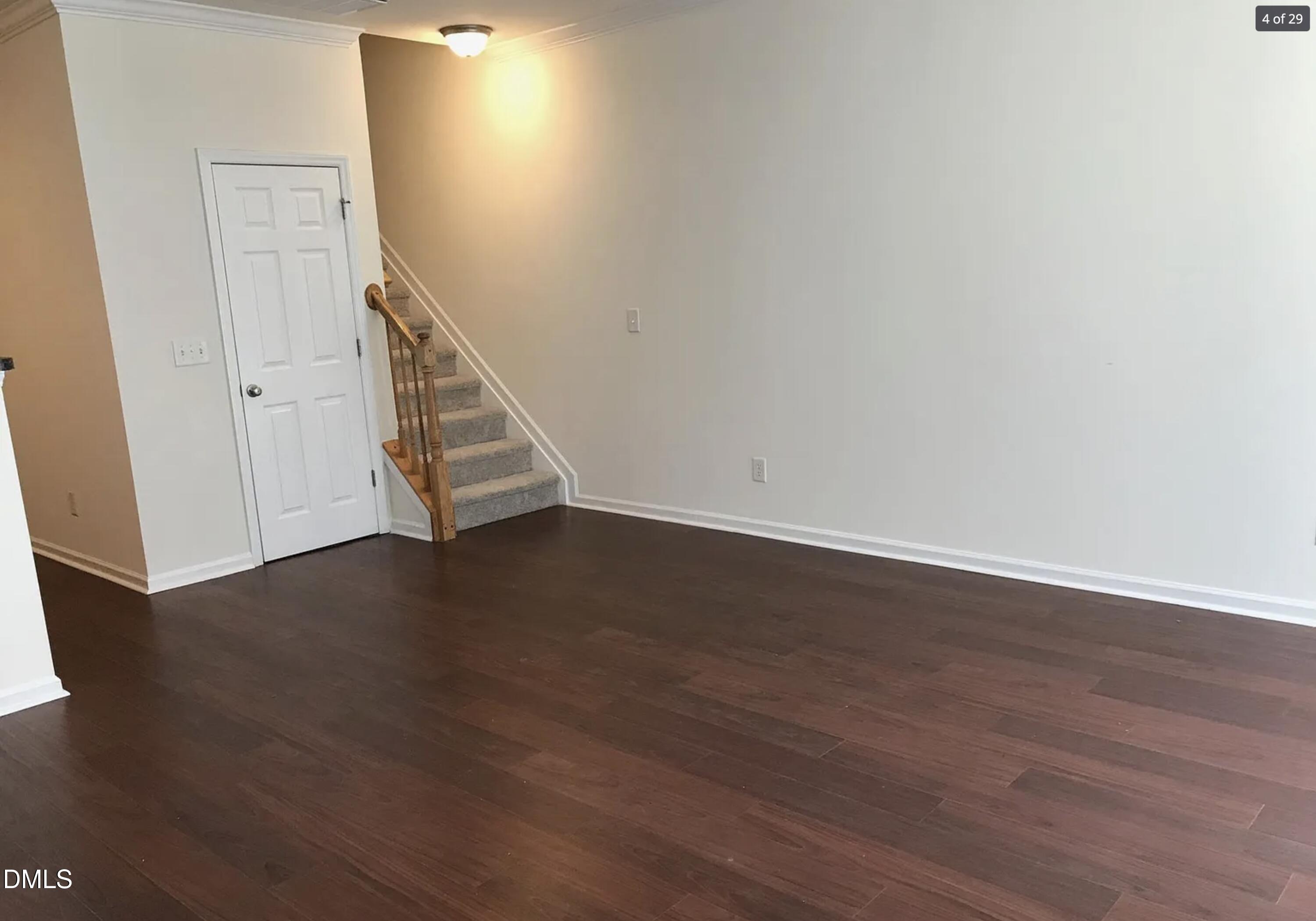 11730 Mezzanine Drive Raleigh, NC 27614 - Photo 5 of 11 an empty room with wooden floor and windows