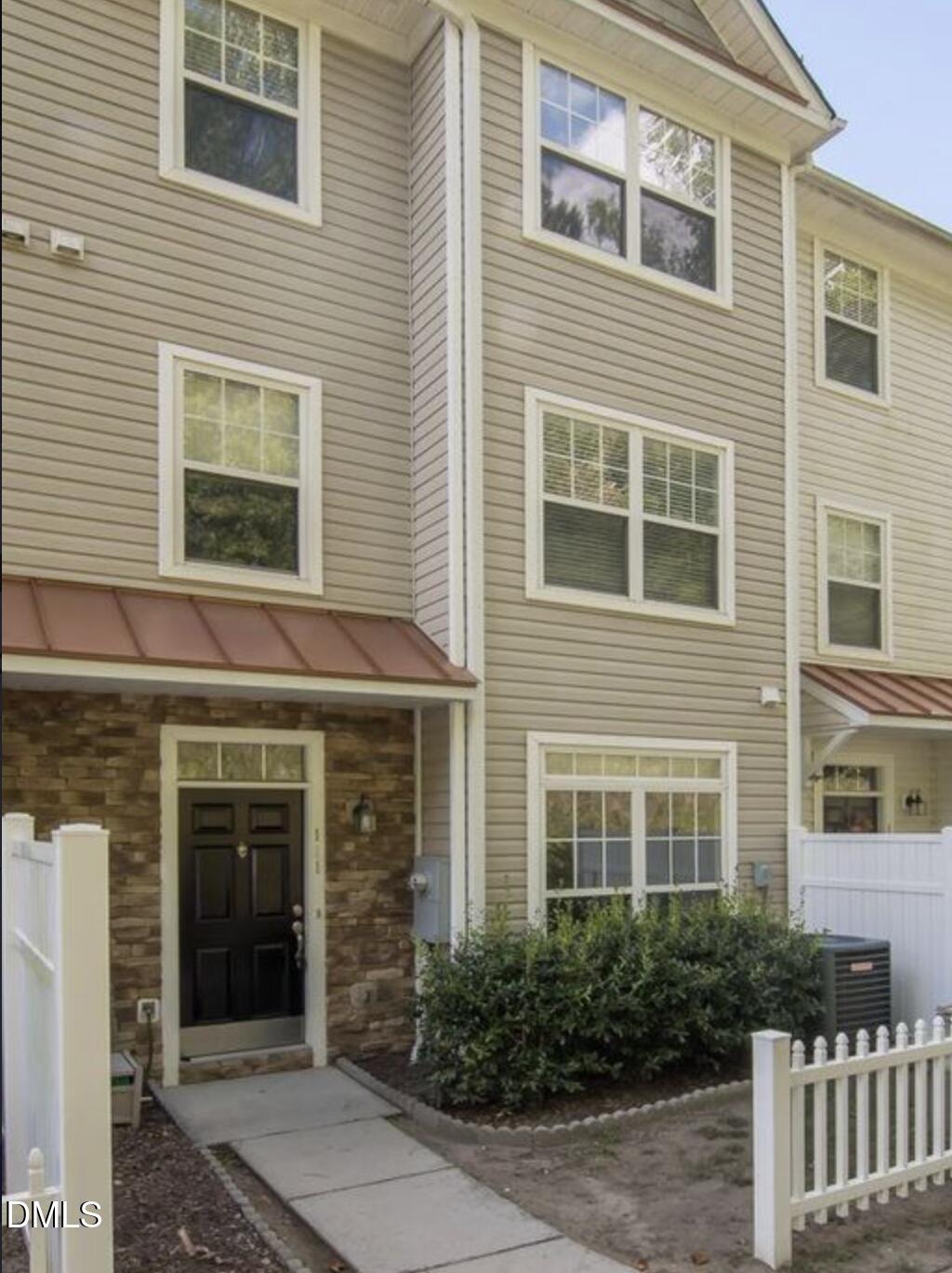 11730 Mezzanine Drive Raleigh, NC 27614 - Photo 10 of 11 a view of a brick house with large windows