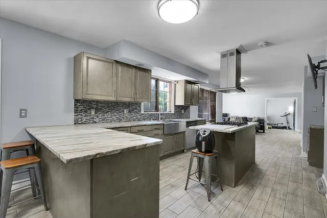 a kitchen with a table and chairs in it