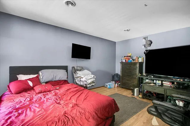 a bed room with a bed and a window