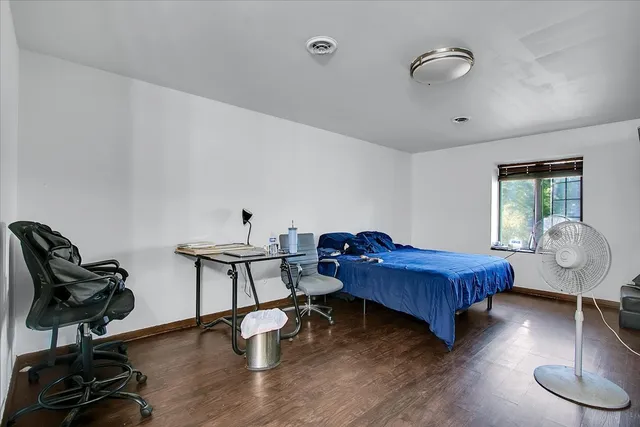 a living room with a flat screen tv and a couch