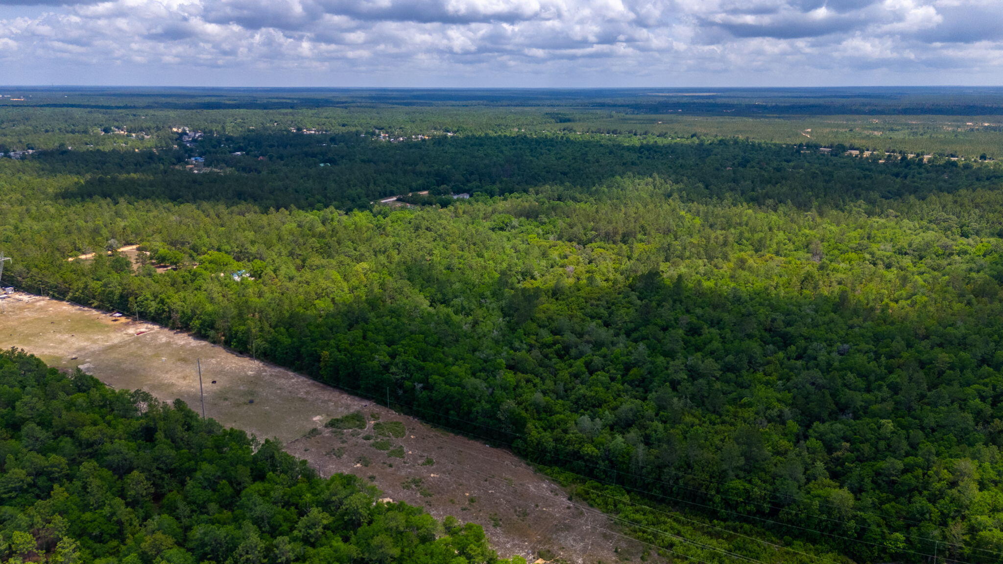 0 Stallion Drive Crestview, FL 32539 - Photo 3 of 10 a view of a lake with a building in the background