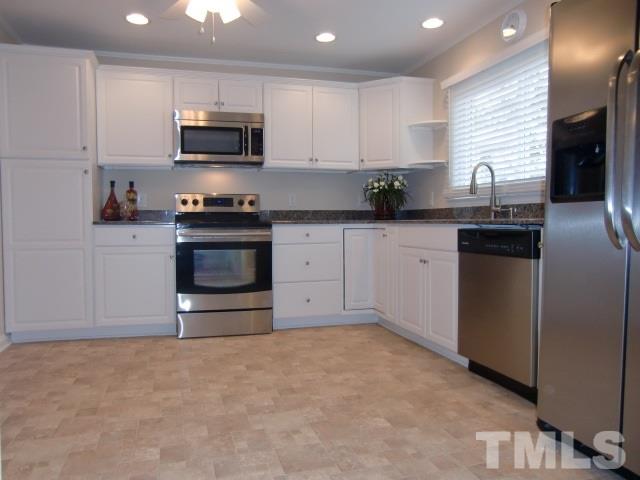 302 Jackson Road Dunn, NC 28334 - Photo 7 of 25 New Cabinets, Granite Counter Tops, New Black & S/S Appliances, New Vinyl Floor, New Can Light Fixtures