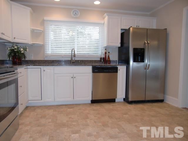 302 Jackson Road Dunn, NC 28334 - Photo 8 of 25 New Cabinets, Granite Counter Tops, New Black & S/S Appliances, New Vinyl Floor, New Can Light Fixtures