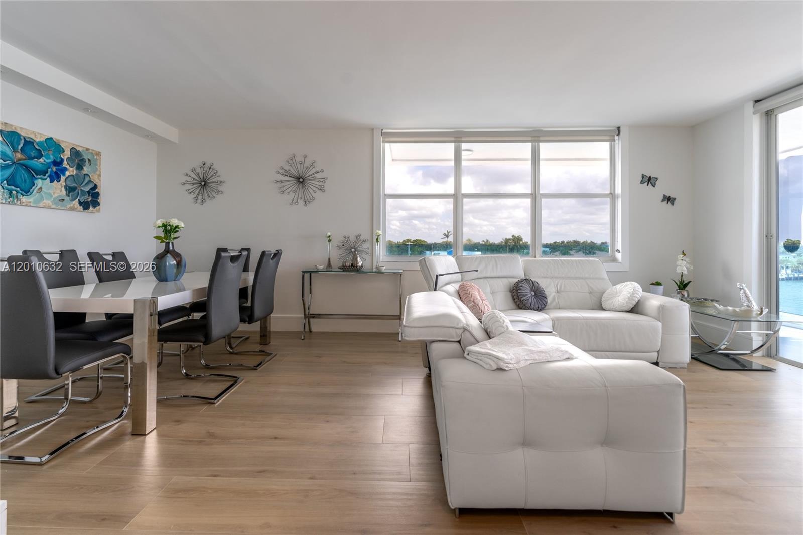 2639 North Riverside Drive, Unit 501 Pompano Beach, FL 33062 - Photo 13 of 39 a living room with furniture and a large window