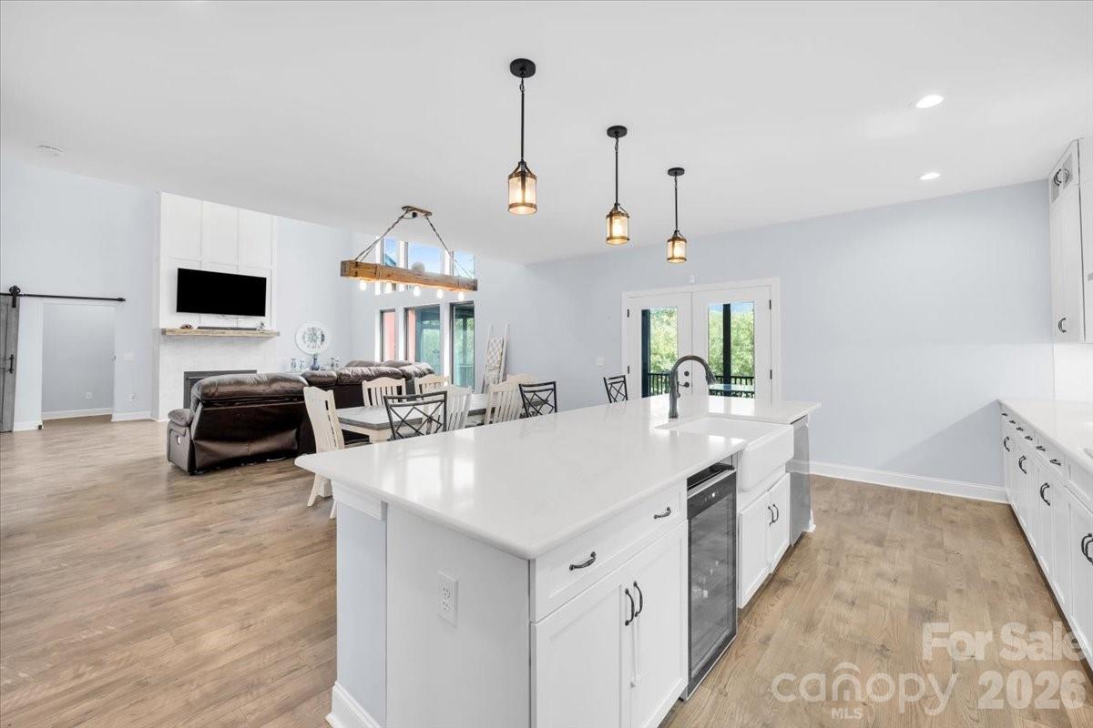 1194 99 Island Road Blacksburg, SC 29702 - Photo 15 of 47 a large kitchen with kitchen island a stove a sink a center island and wooden floor