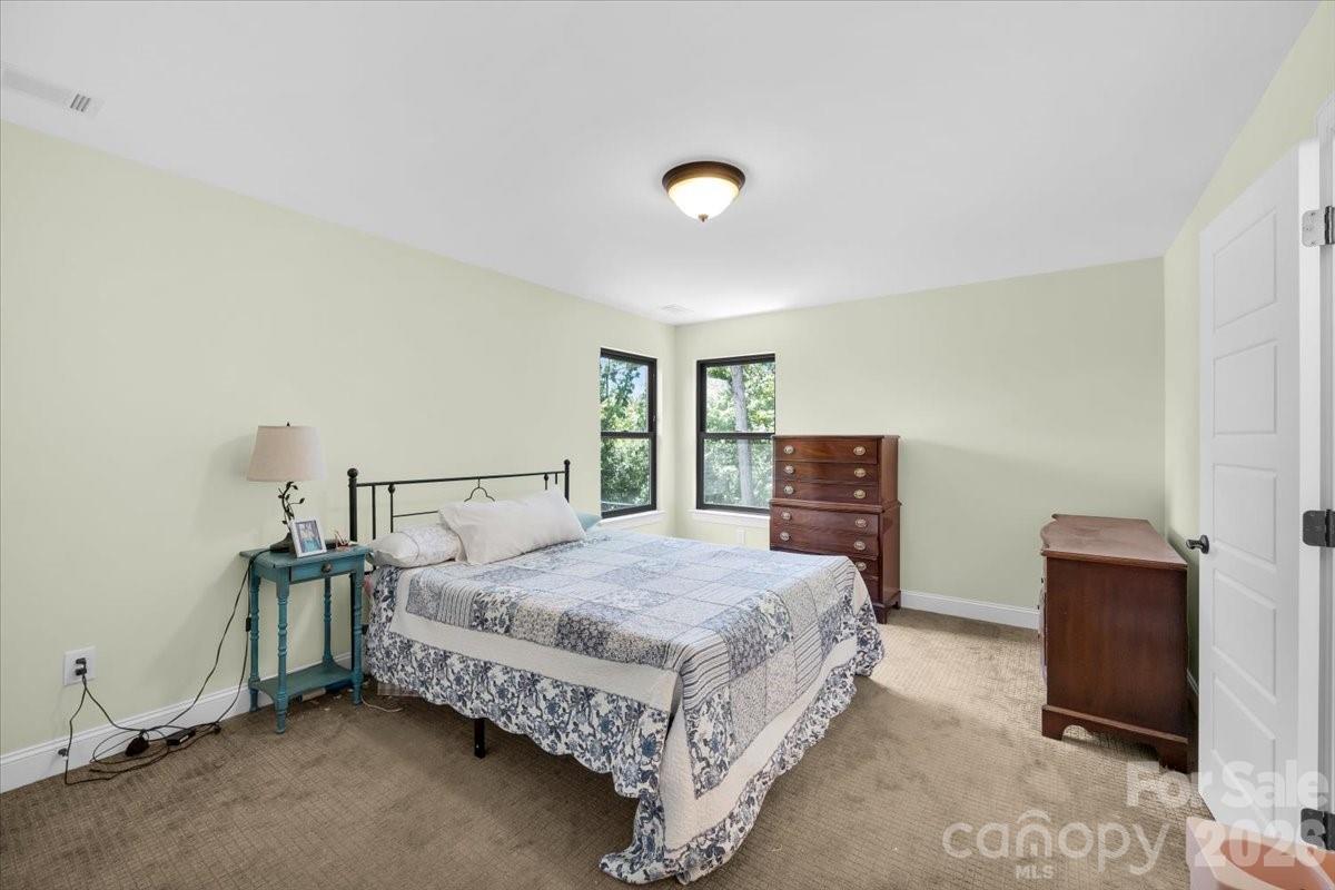 1194 99 Island Road Blacksburg, SC 29702 - Photo 18 of 47 a bedroom with a bed and a lamp