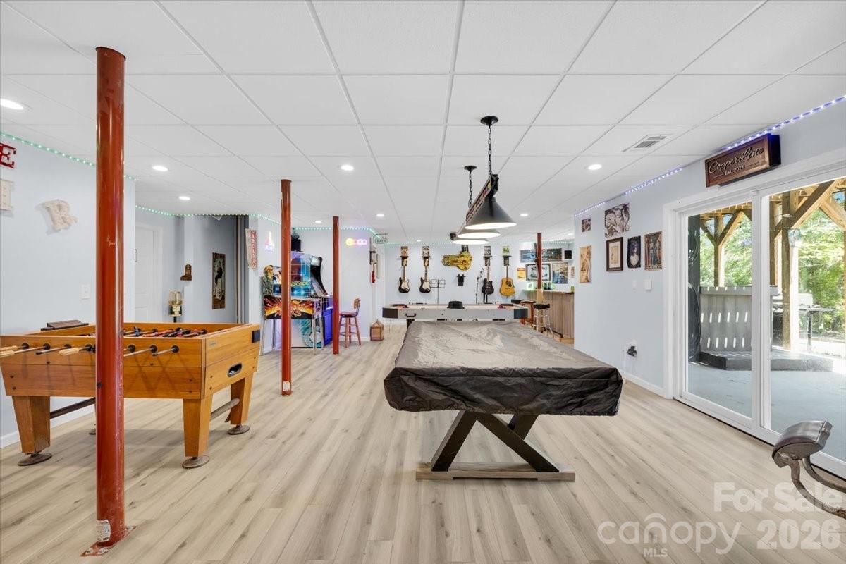 1194 99 Island Road Blacksburg, SC 29702 - Photo 29 of 47 a living room with furniture a wooden floor and a large window