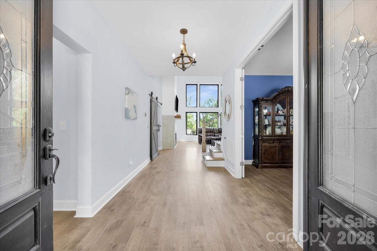 1194 99 Island Road Blacksburg, SC 29702 - Photo 4 of 47 a view of a hallway with wooden floor and staircase