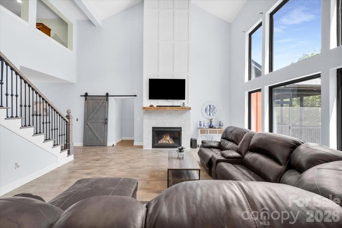 1194 99 Island Road Blacksburg, SC 29702 - Photo 6 of 47 a living room with furniture a flat screen tv and a fireplace
