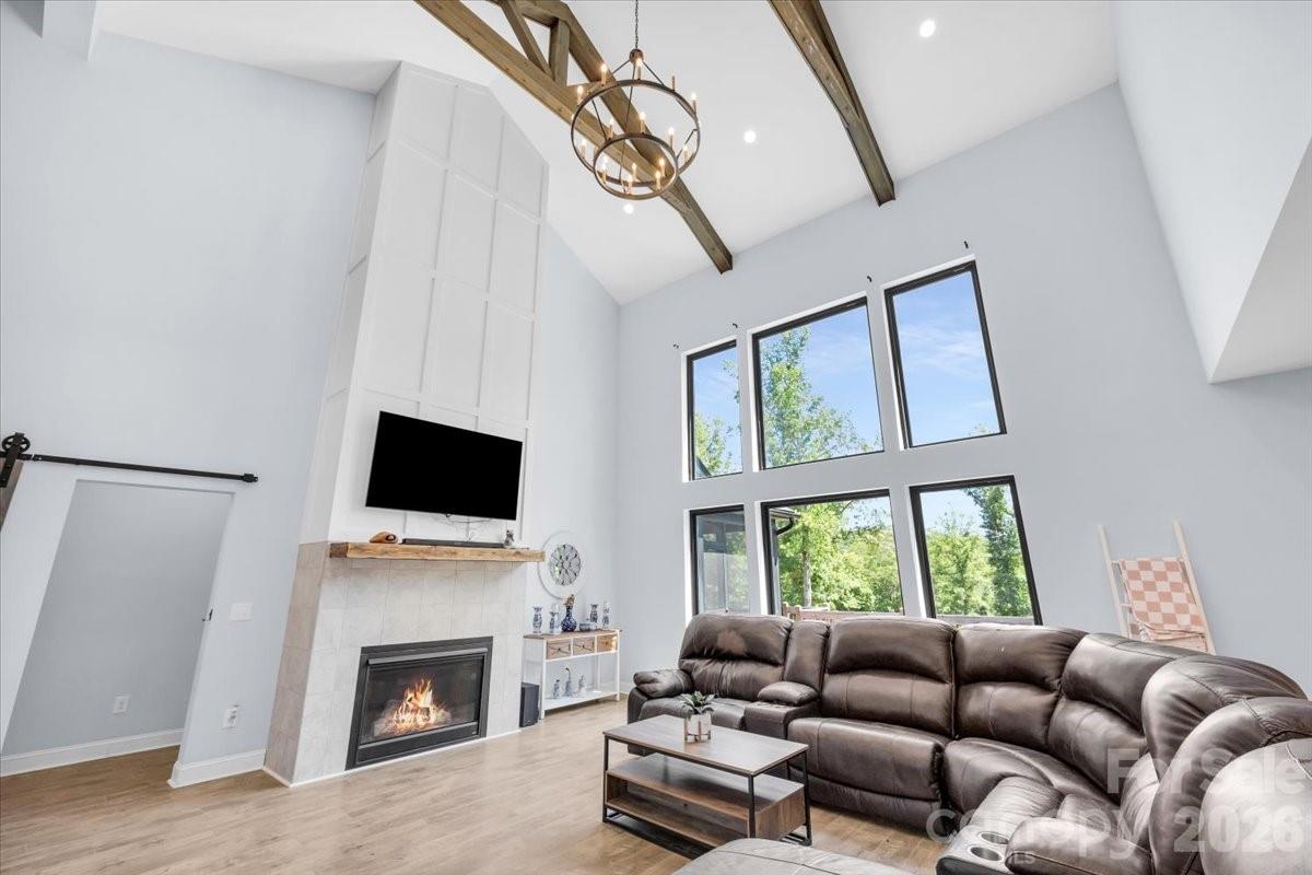 1194 99 Island Road Blacksburg, SC 29702 - Photo 7 of 47 a living room with furniture a fireplace and a flat screen tv