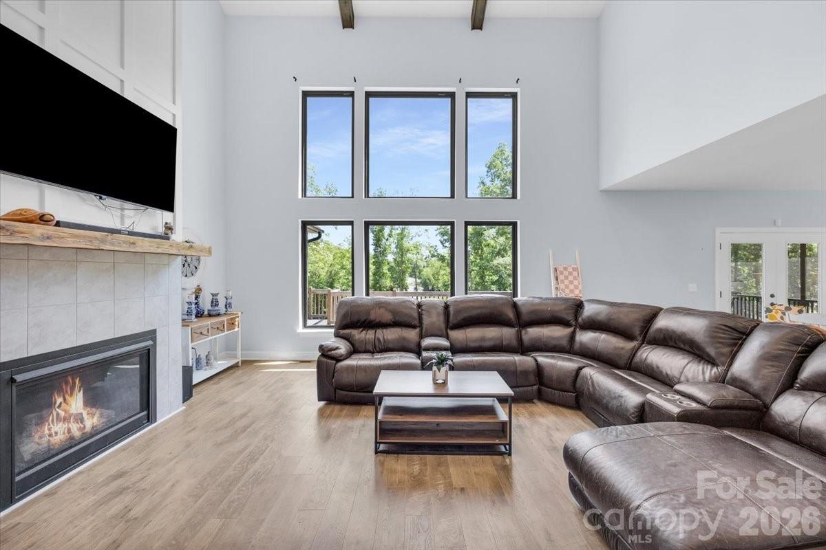 1194 99 Island Road Blacksburg, SC 29702 - Photo 8 of 47 a living room with furniture flat screen tv and a fireplace