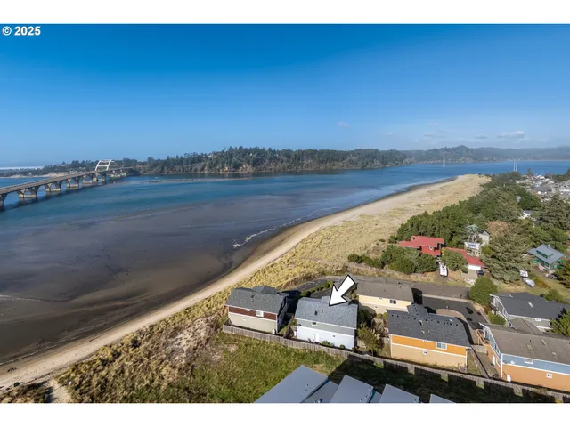 a view of a backyard with sitting area