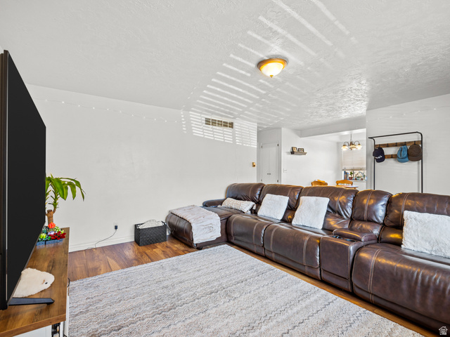460 200 South Provo, UT 84606 - Photo 36 of 66 Living room featuring wood finished floors and a textured ceiling