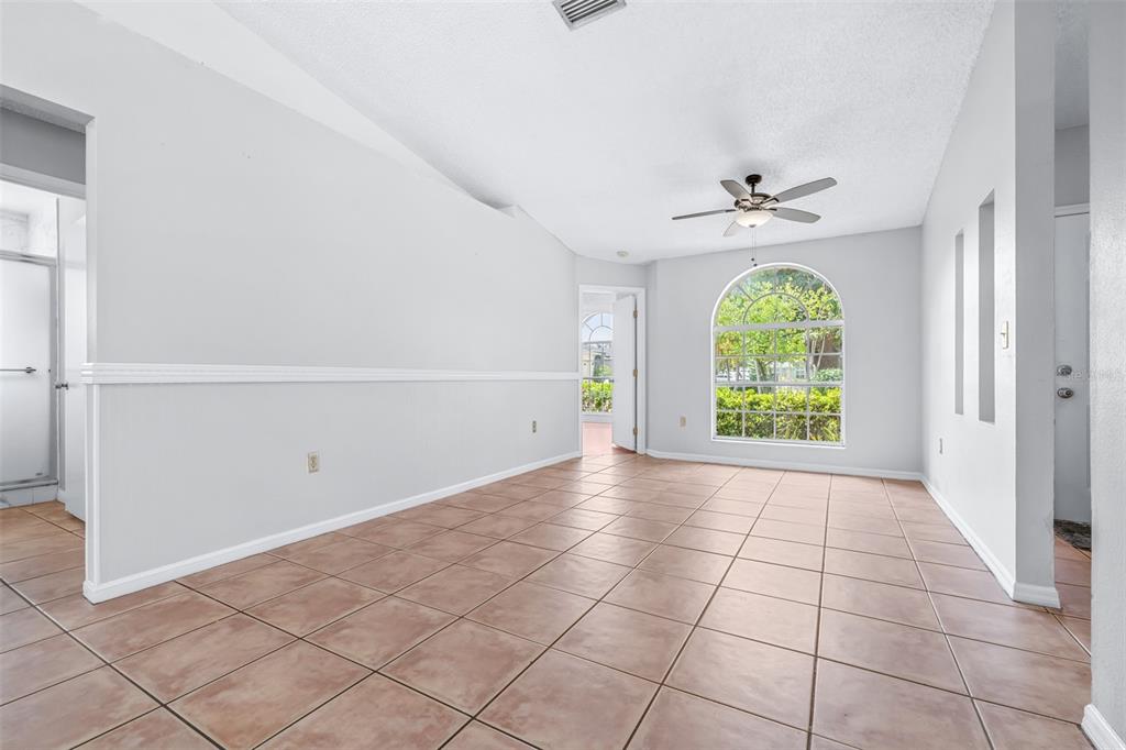 2538 Countryside Pines Drive Clearwater, FL 33761 - Photo 13 of 61 an empty room with fan and windows