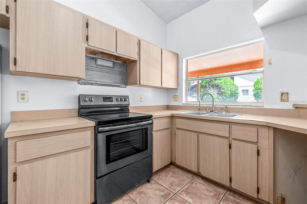 2538 Countryside Pines Drive Clearwater, FL 33761 - Photo 18 of 61 a kitchen with cabinets appliances and a sink