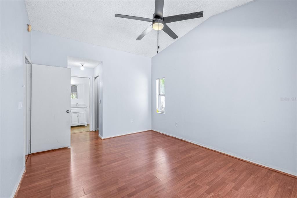 2538 Countryside Pines Drive Clearwater, FL 33761 - Photo 21 of 61 a view of an empty room with wooden floor