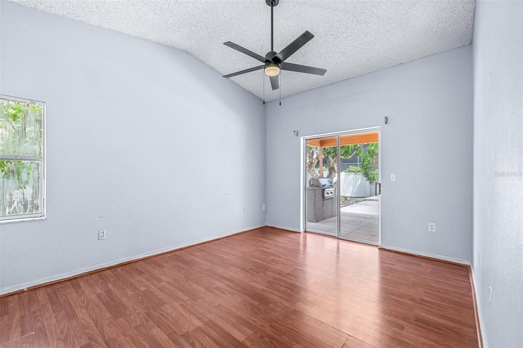 2538 Countryside Pines Drive Clearwater, FL 33761 - Photo 24 of 61 an empty room with wooden floor and windows