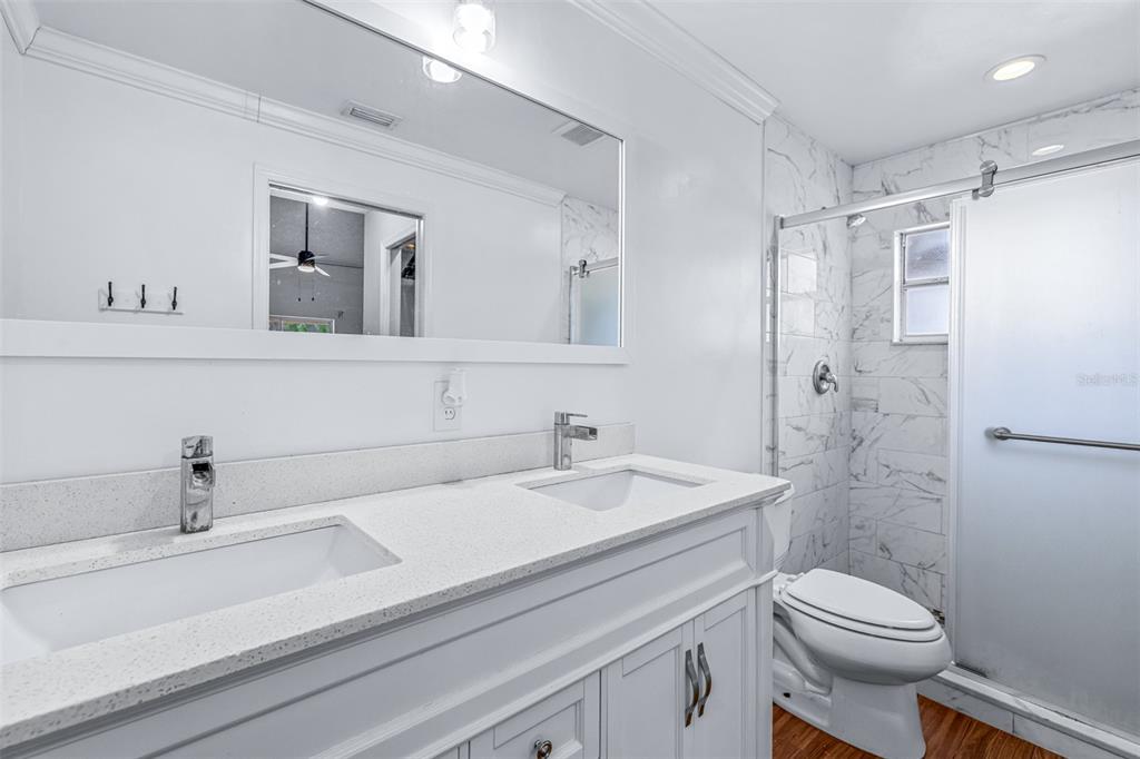 2538 Countryside Pines Drive Clearwater, FL 33761 - Photo 26 of 61 a bathroom with a sink a toilet and shower