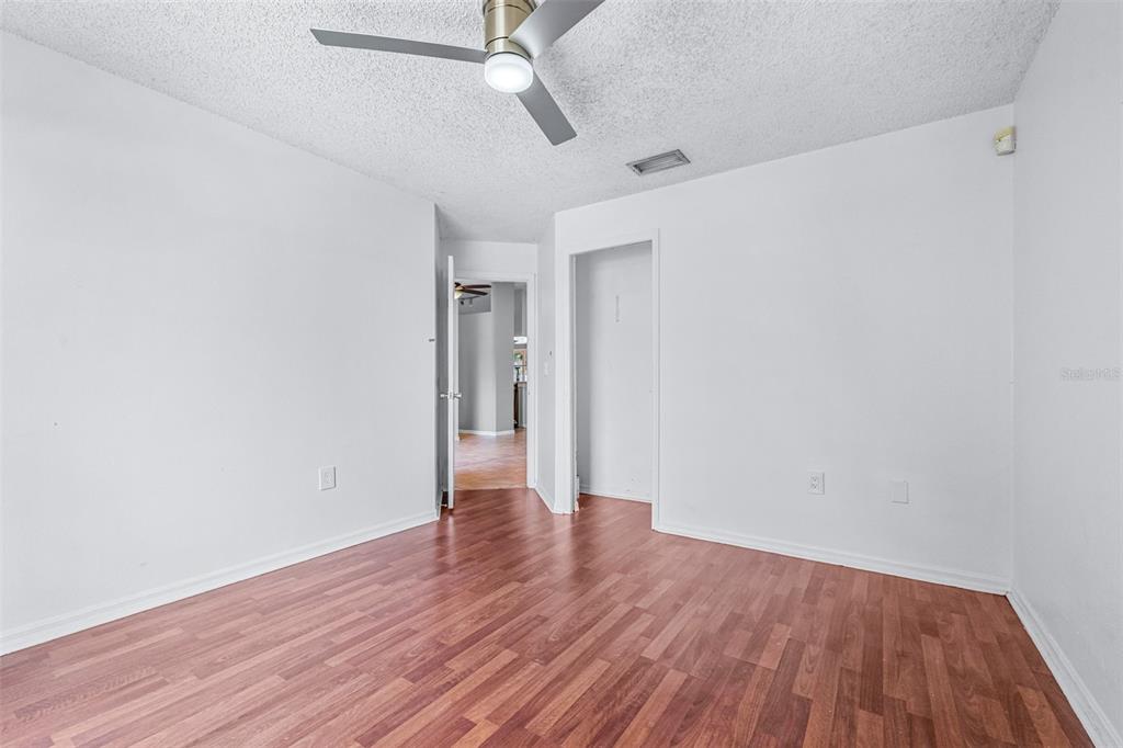 2538 Countryside Pines Drive Clearwater, FL 33761 - Photo 28 of 61 a view of an empty room with wooden floor
