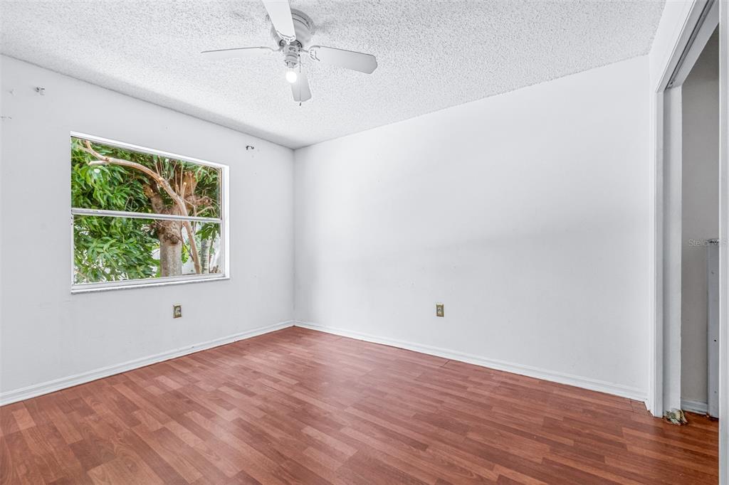 2538 Countryside Pines Drive Clearwater, FL 33761 - Photo 31 of 61 wooden floor in an empty room with a window