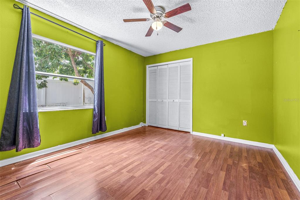 2538 Countryside Pines Drive Clearwater, FL 33761 - Photo 33 of 61 a view of a room with wooden floor and a ceiling fan