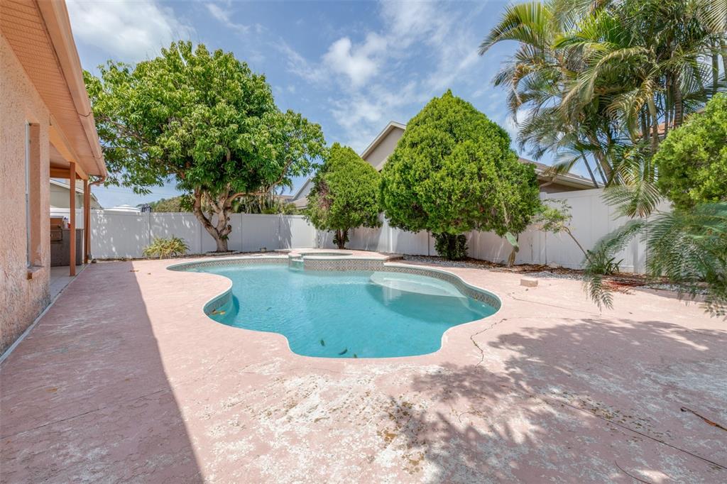 2538 Countryside Pines Drive Clearwater, FL 33761 - Photo 40 of 61 a view of a swimming pool with a yard