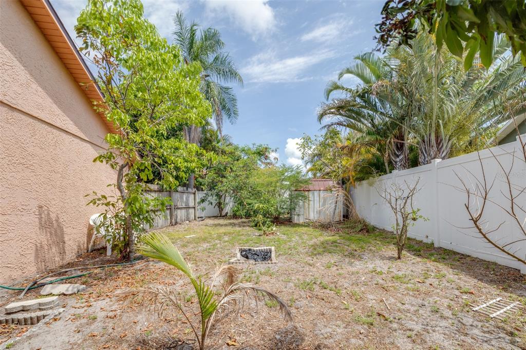 2538 Countryside Pines Drive Clearwater, FL 33761 - Photo 45 of 61 a view of a yard with a bench