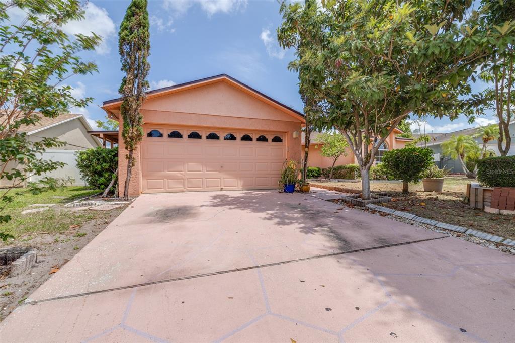 2538 Countryside Pines Drive Clearwater, FL 33761 - Photo 5 of 61 a front view of a house with a yard