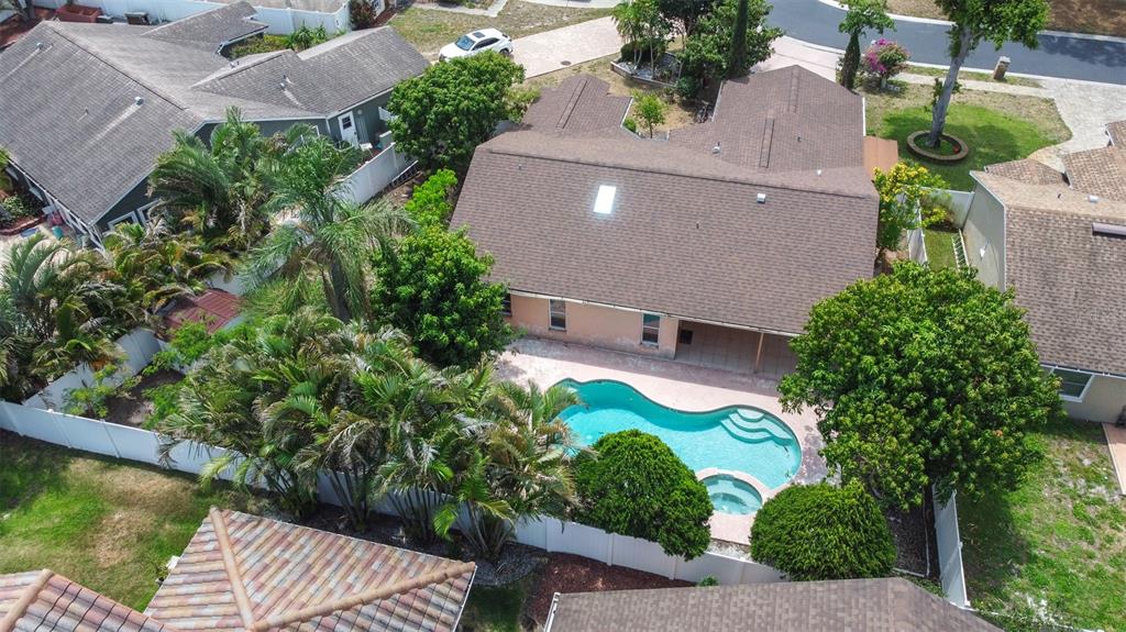 2538 Countryside Pines Drive Clearwater, FL 33761 - Photo 56 of 61 an aerial view of a house with garden space and a street view