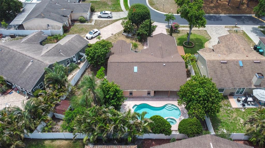 2538 Countryside Pines Drive Clearwater, FL 33761 - Photo 57 of 61 an aerial view of a house with a yard and garden