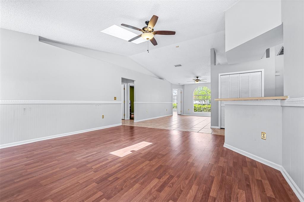 2538 Countryside Pines Drive Clearwater, FL 33761 - Photo 9 of 61 a view of an empty room with window and wooden floor