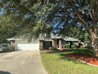 2504 Mallory Hills Road Jacksonville, FL 32221 - Photo 1 of 30 a front view of a house with a yard