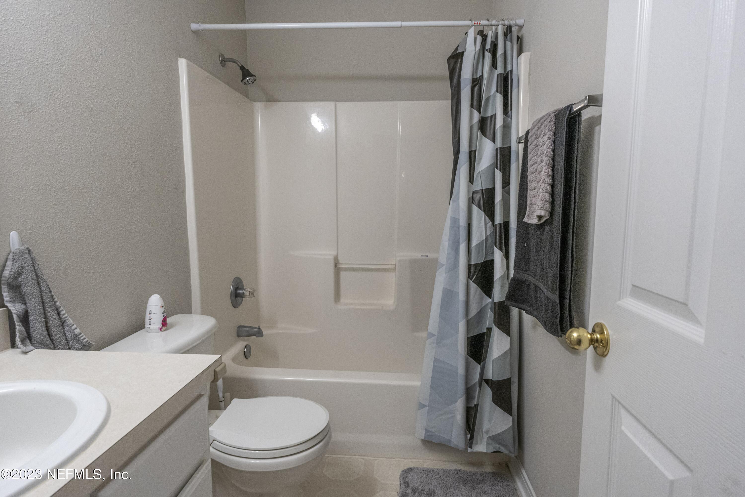2504 Mallory Hills Road Jacksonville, FL 32221 - Photo 24 of 30 a bathroom with a sink toilet and shower