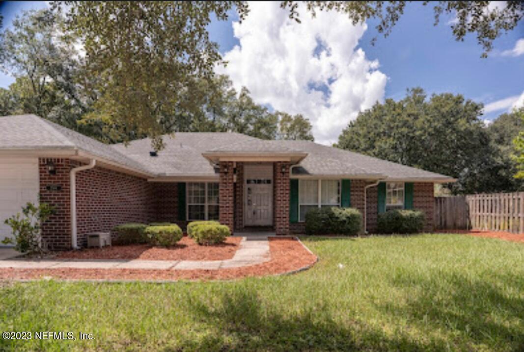 2504 Mallory Hills Road Jacksonville, FL 32221 - Photo 26 of 30 a front view of a house with garden