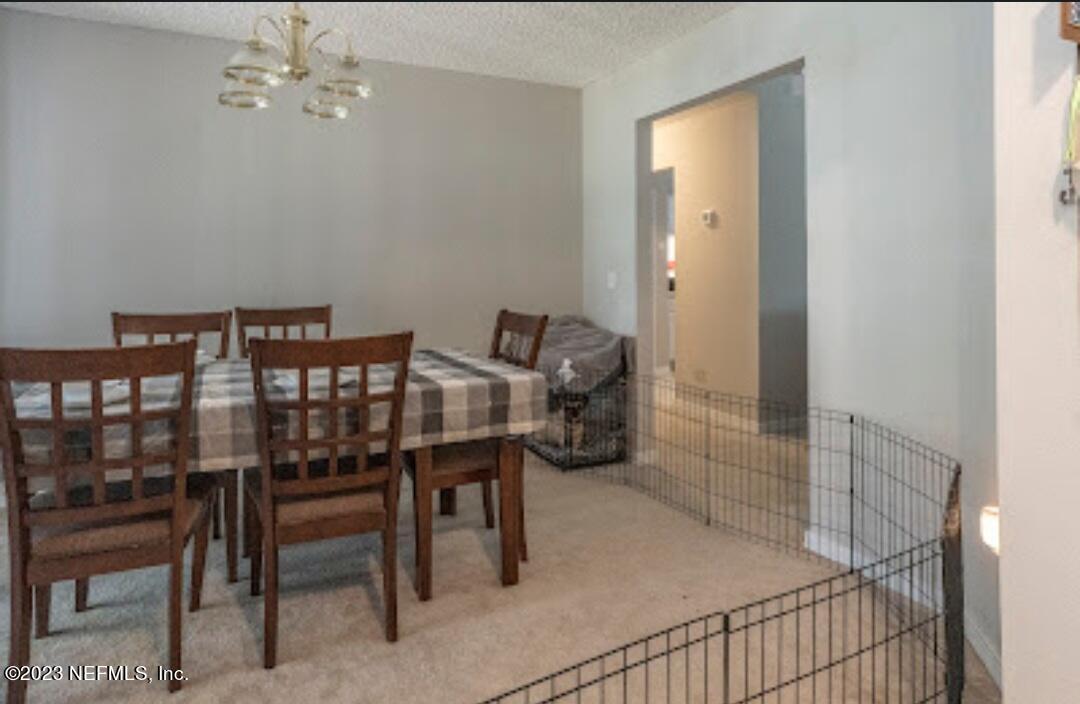 2504 Mallory Hills Road Jacksonville, FL 32221 - Photo 5 of 30 a view of a dining room with furniture