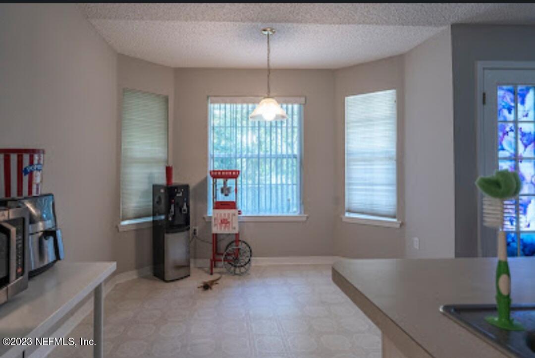 2504 Mallory Hills Road Jacksonville, FL 32221 - Photo 9 of 30 a view of a room with workspace and windows
