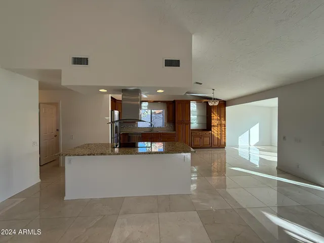a view of a hallway with a living room