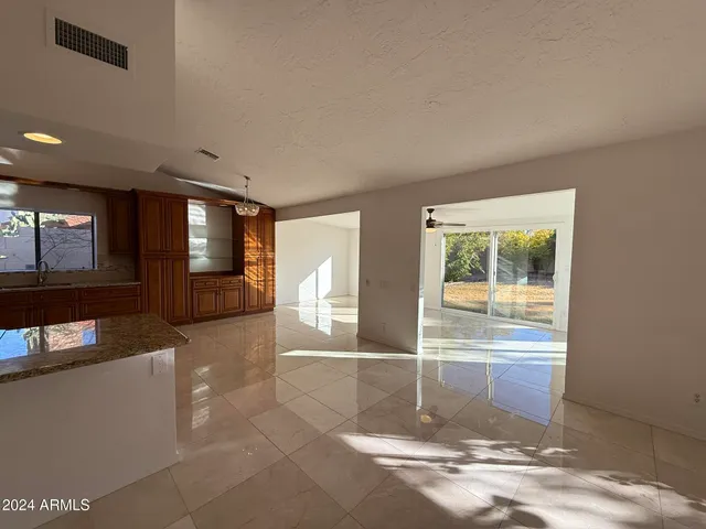 a view of living room with furniture and windows