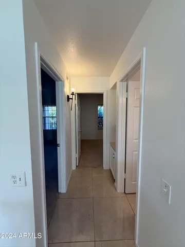 a bathroom with a shower and a mirror