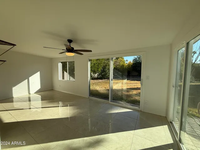 a view of a bathroom with a tub and shower