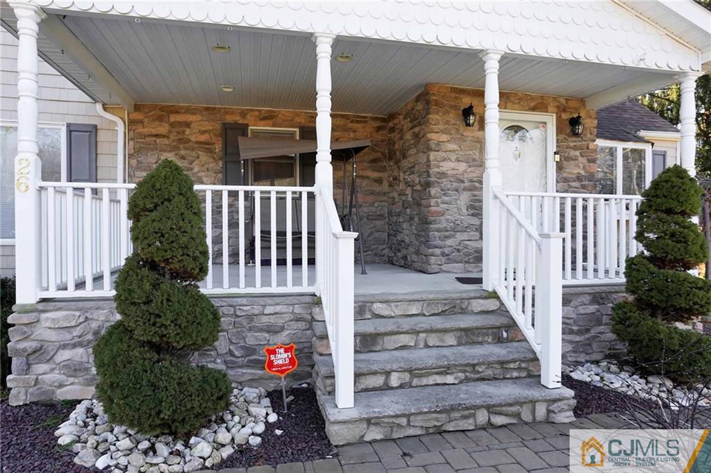 26 Pleasant Valley Road Old Bridge, NJ 08857 - Photo 2 of 25 a front view of a house with a garden