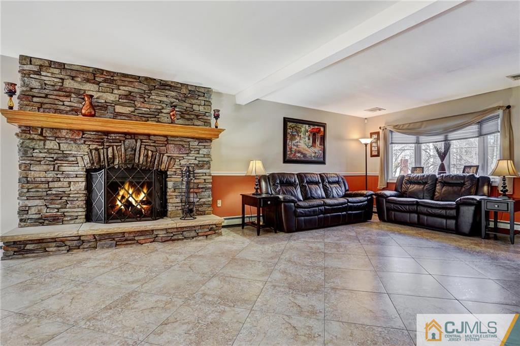 26 Pleasant Valley Road Old Bridge, NJ 08857 - Photo 12 of 25 a living room with furniture and a fireplace