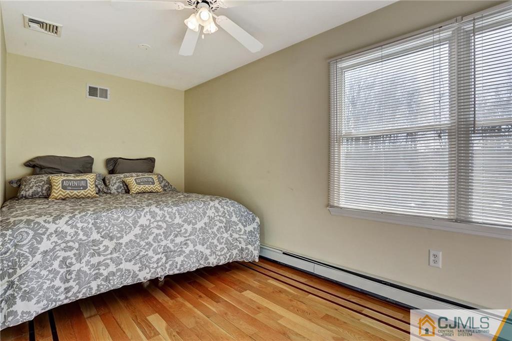 26 Pleasant Valley Road Old Bridge, NJ 08857 - Photo 17 of 25 a bedroom with a bed and window