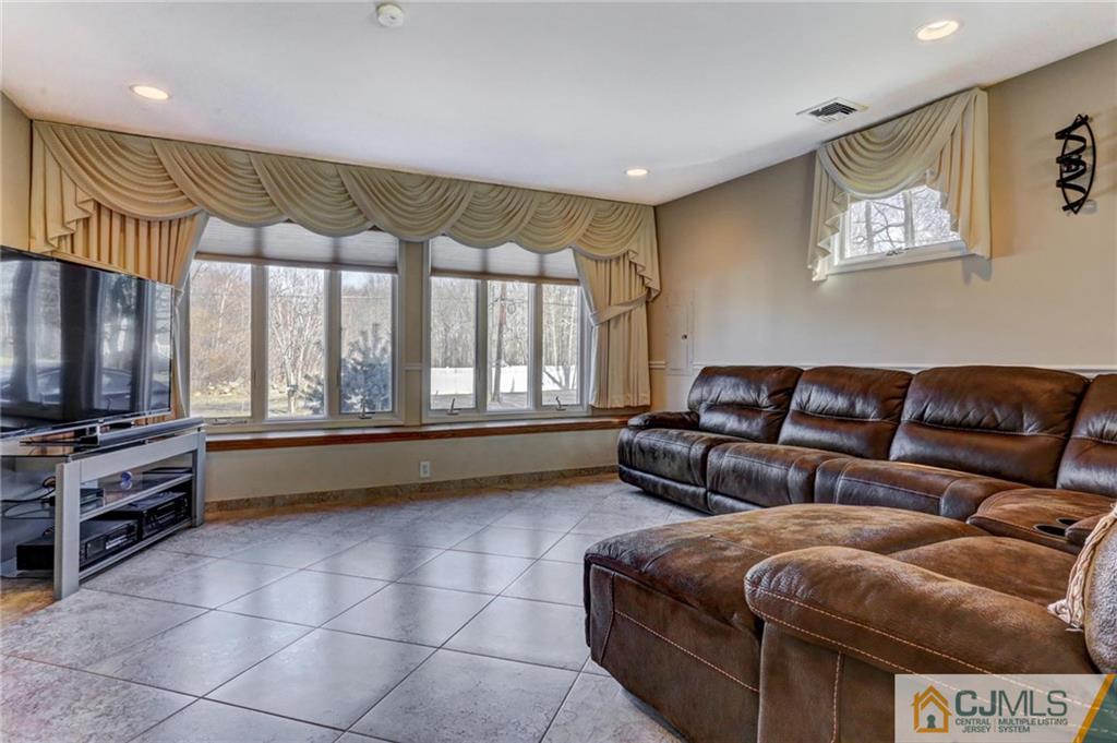 26 Pleasant Valley Road Old Bridge, NJ 08857 - Photo 20 of 25 a living room with furniture and a flat screen tv