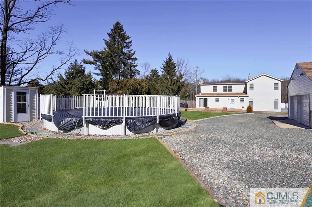 26 Pleasant Valley Road Old Bridge, NJ 08857 - Photo 24 of 25 a view of a house with a yard and sitting area