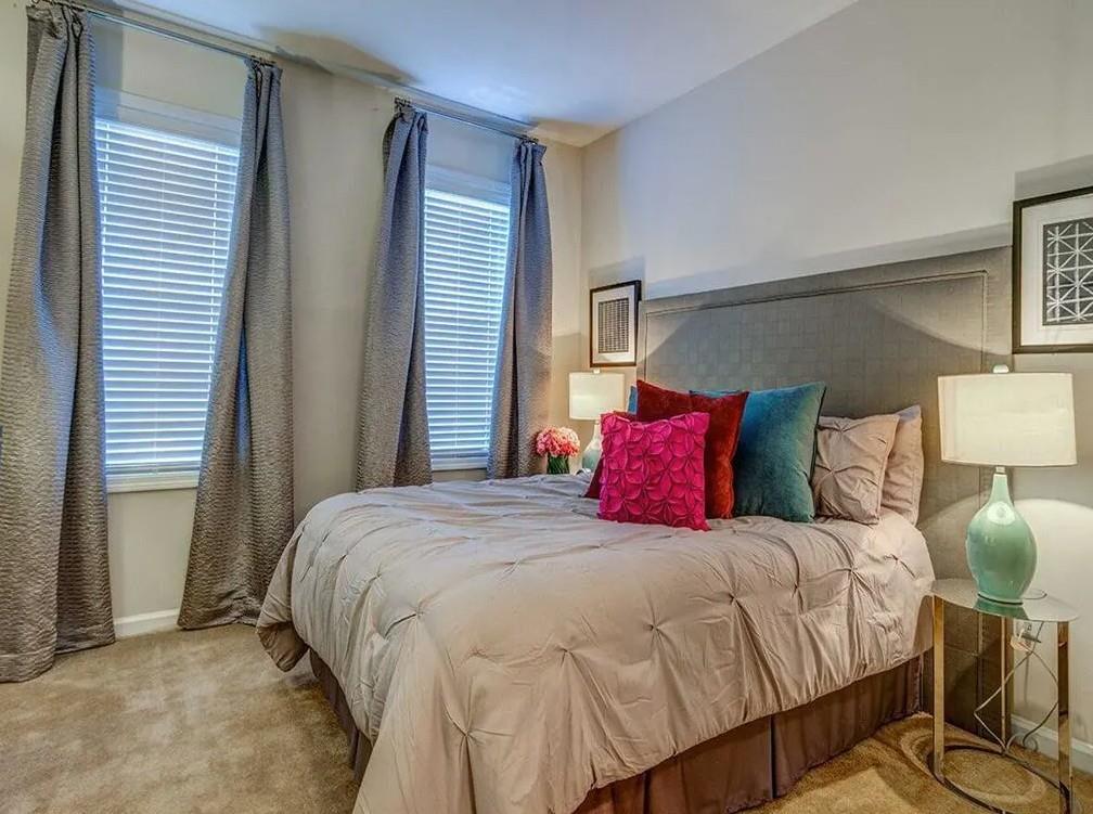 1600 Blairs Bridge Road, Unit 1701 Lithia Springs, GA 30122 - Photo 11 of 21 a bedroom with a bed and wooden floor